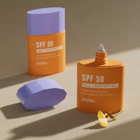 two GIDEA SPF 50 sunscreen tottle containers, featuring bright orange bodies and lavender hexagonal caps, set on a neutral surface under soft directional lighting